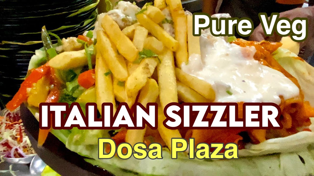 Italian Sizzler cooking with Olive Oil, Pasta In Red Sauce, Crispy Mushroom, Stir Fried Vegetable