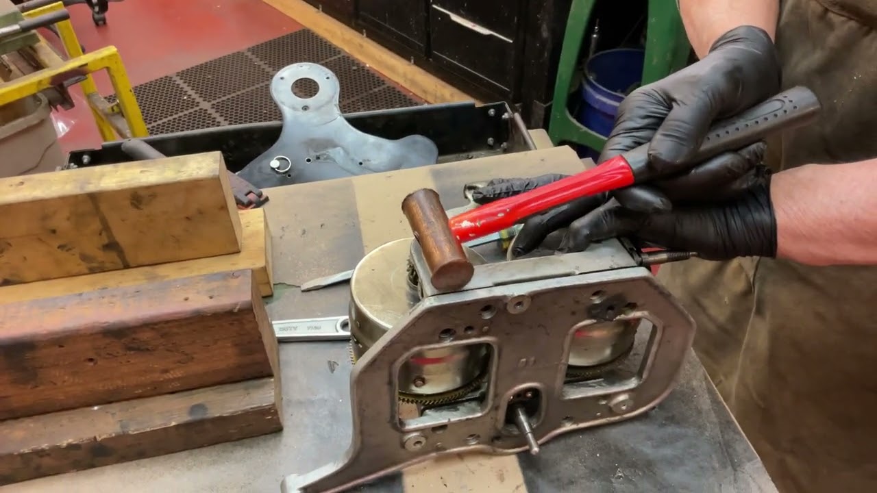 962.  Taking apart a Brunswick 4-spring motor