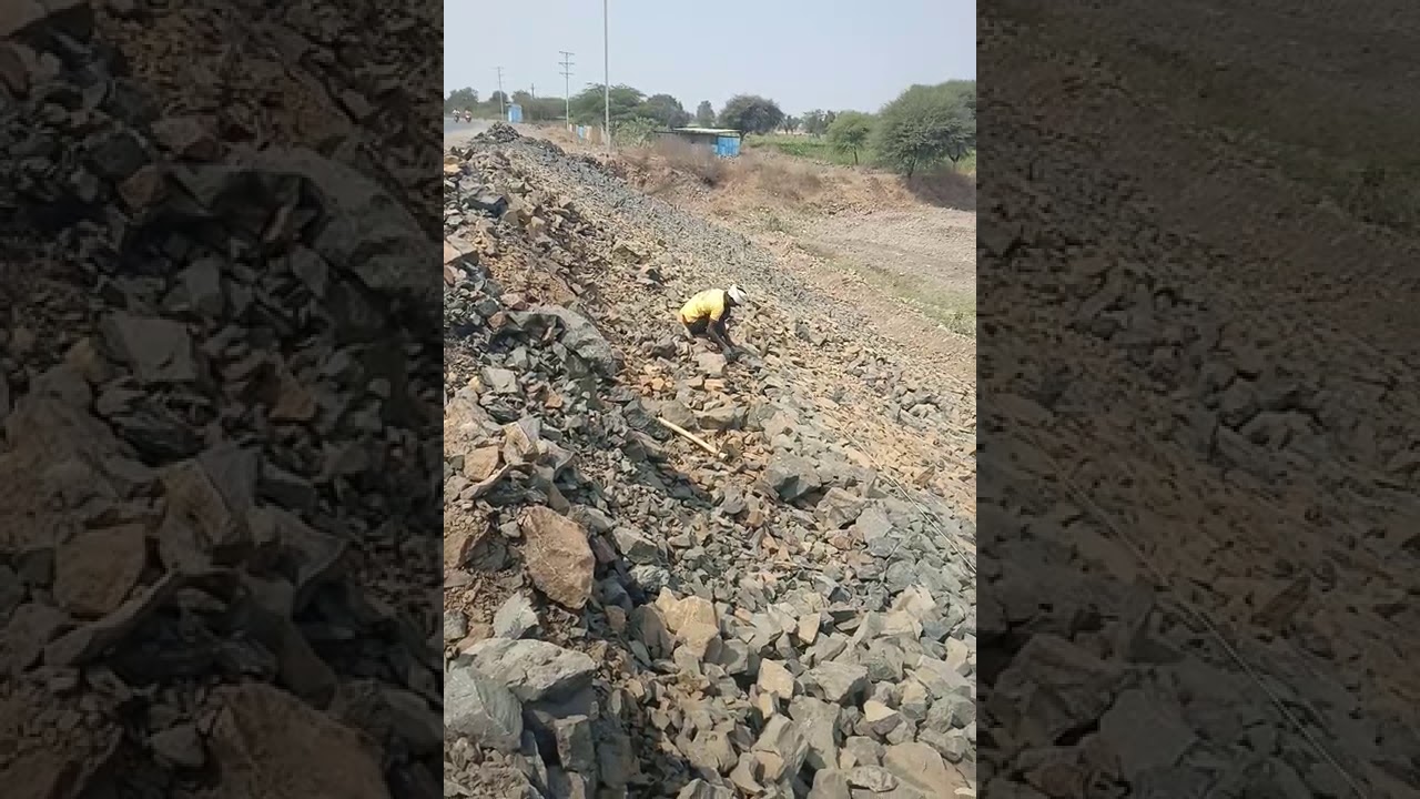 Stone pitching work on road side river