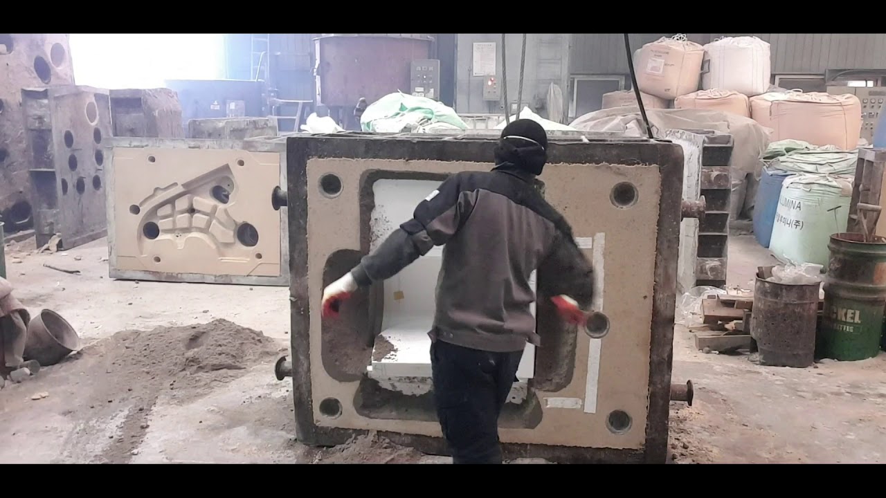 Sand mold metal casting process