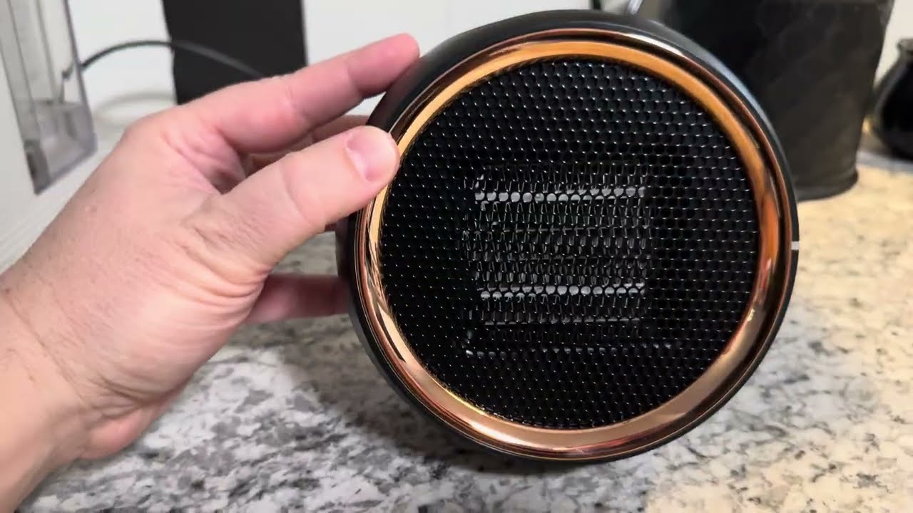 Small portable electric space heater with tip over shut off protection 