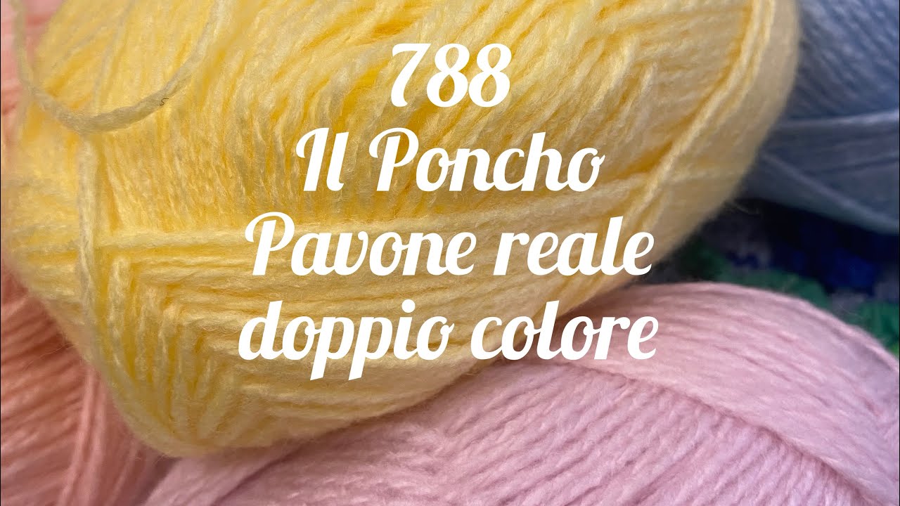 Il poncho con il punto pavone doppio colore