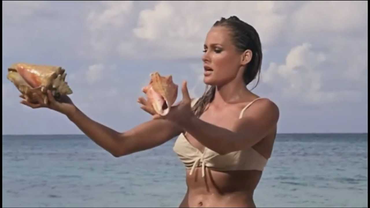 Ursula Andress (Honey Ryder) in bikini walking Jamaica's Dunn's River beach in Dr No 1962