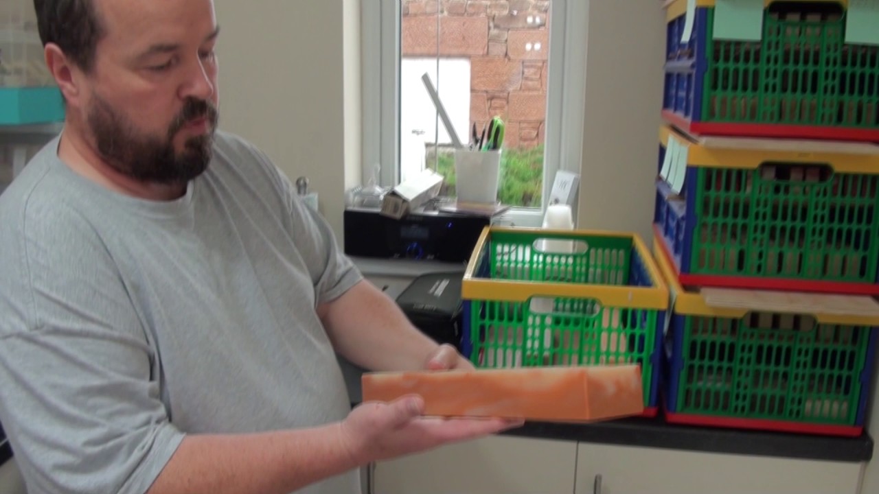 Cutting the soap loafs and setting them to cure