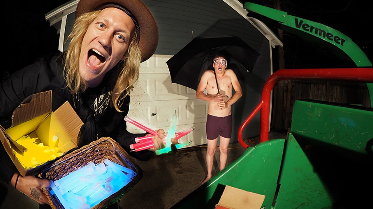 1000 Glow Sticks in a Wood Chipper VS Umbrella Man!
