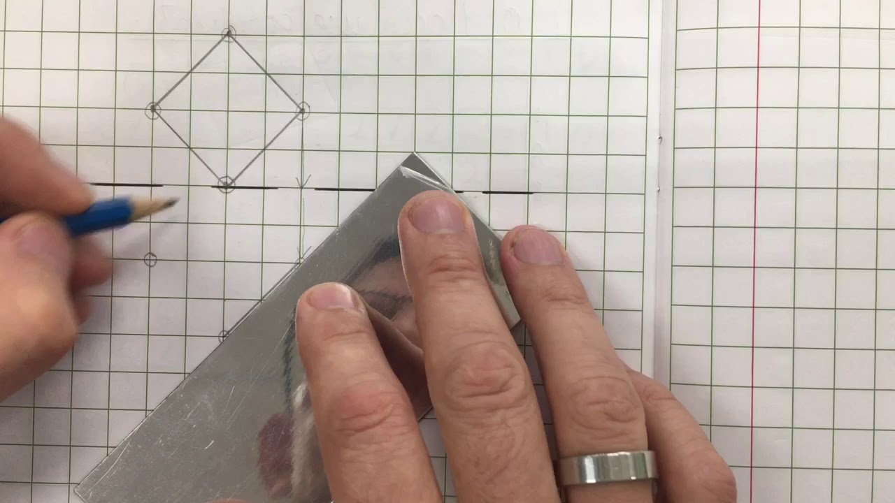 Reflecting shapes in a mirror line