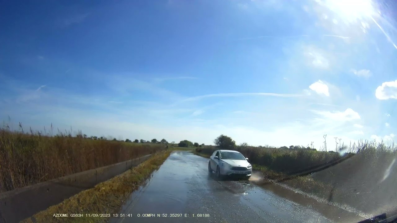 Serious flooding on B1127 road outside Reydon Suffolk England UK amidst heatwave on 11.9.23