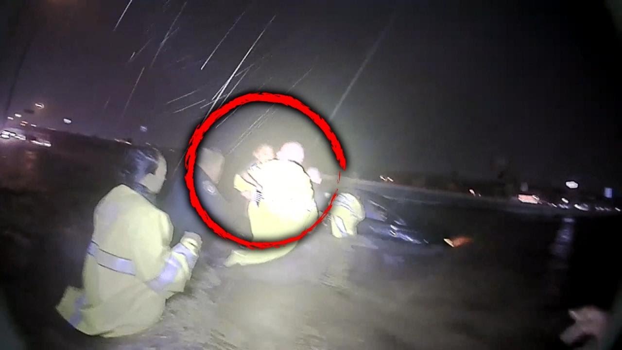 Cops Form Human Chain to Rescue Family Trapped in Car
