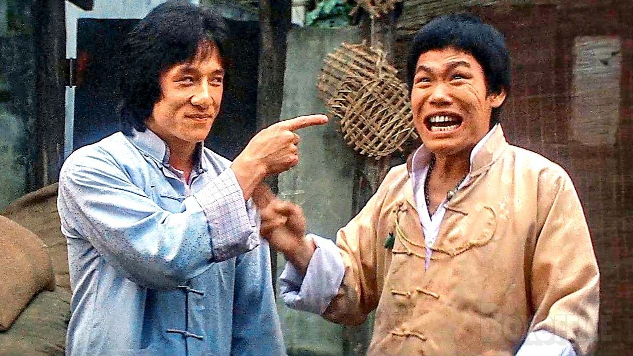 Jackie Chan protects a woman from thugs