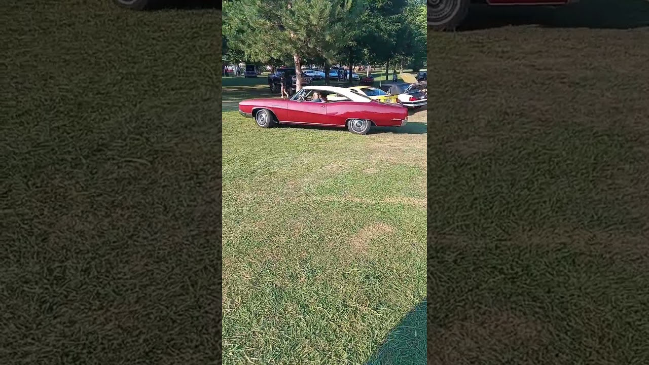 red 60s car drives on grass easily!