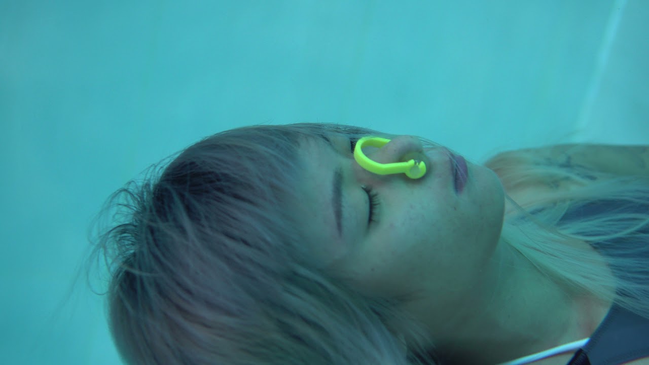 girl underwater breathholding wtih empty lung in 5M depth pool