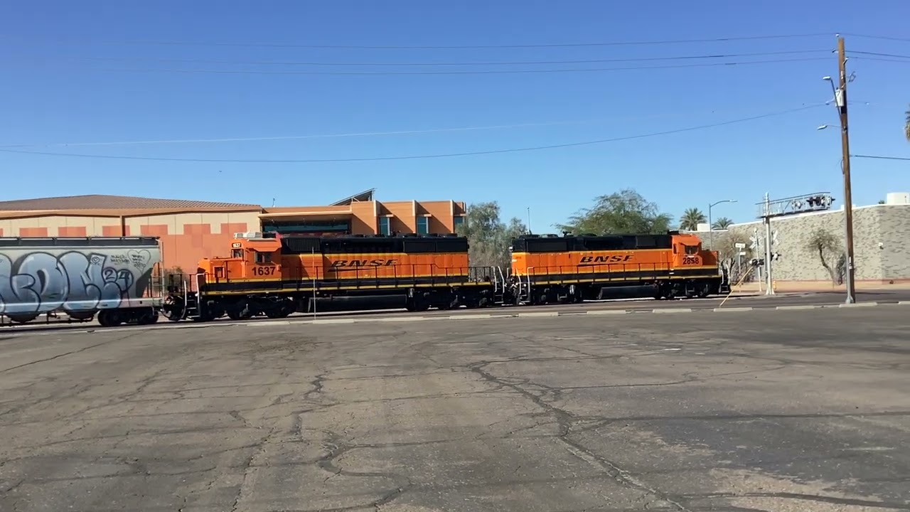BNSF 2858 leads a local job across 19th Ave and Madison Street crossing going to Mobest yard
