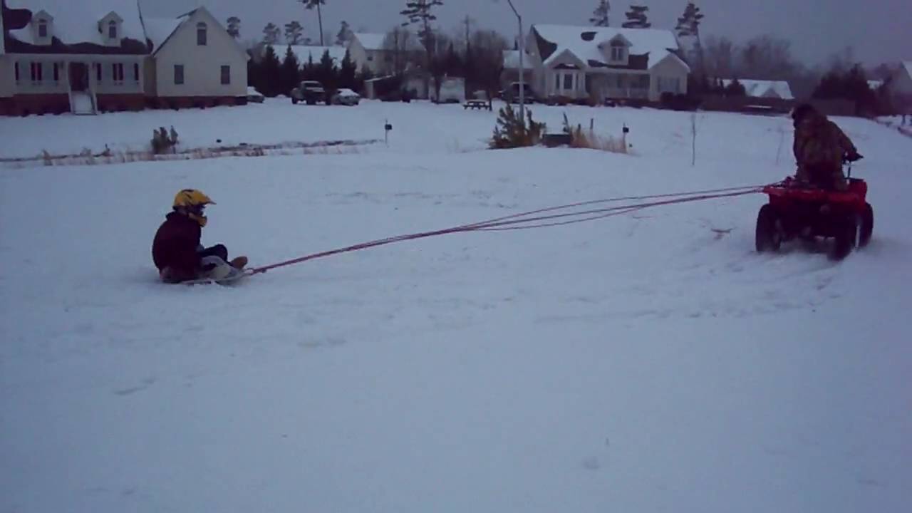 Pulling Alex on a satellite dish sled
