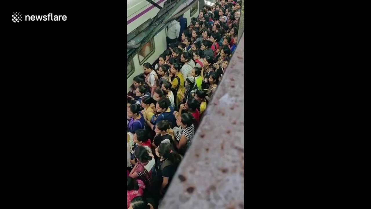 Women battle rush-hour crush to get into Mumbai train