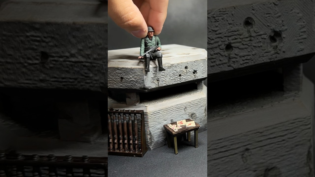 Żołnierze armii malują niemiecki bunkier D-Day z II wojny światowej