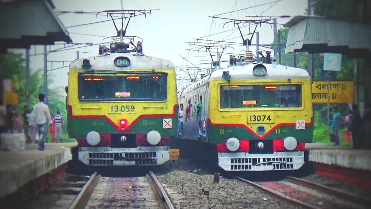 Hide & seek train crossing | one EMU train Emerging from the behind of another EMU train