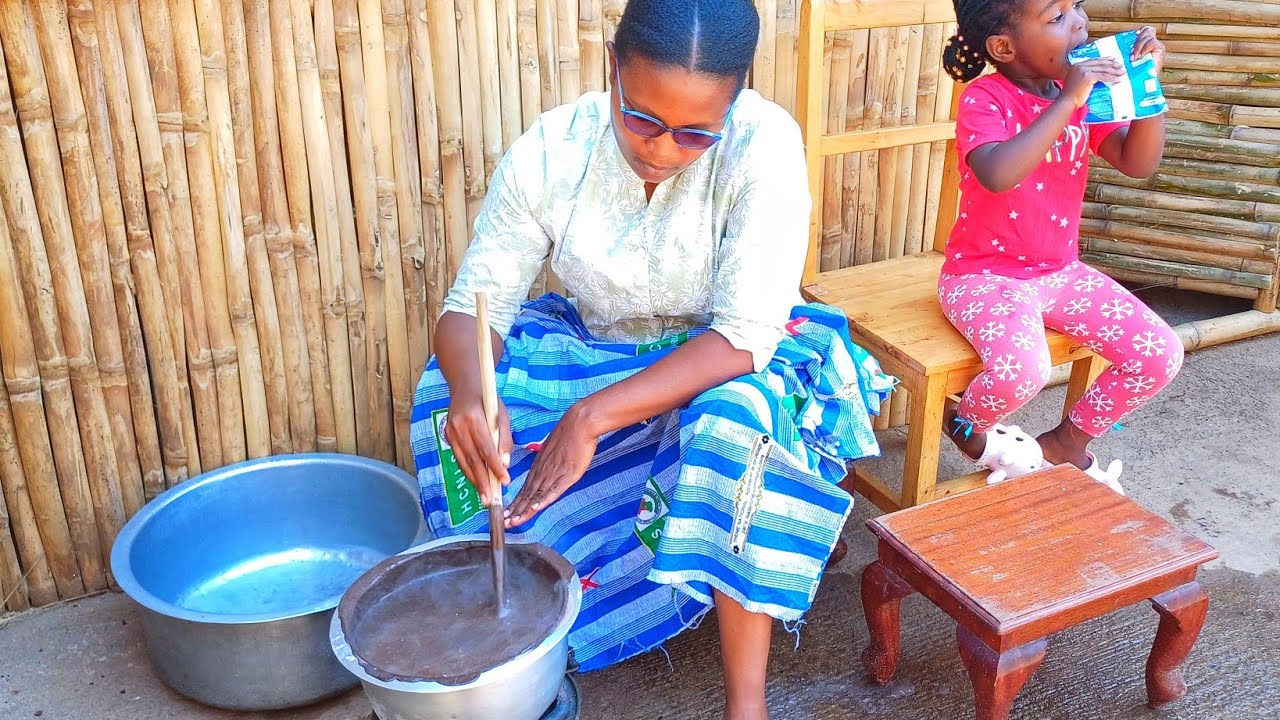 African  village life/ cooking and preparing fermented sorghum  drink( Gukora UBUSHERA)