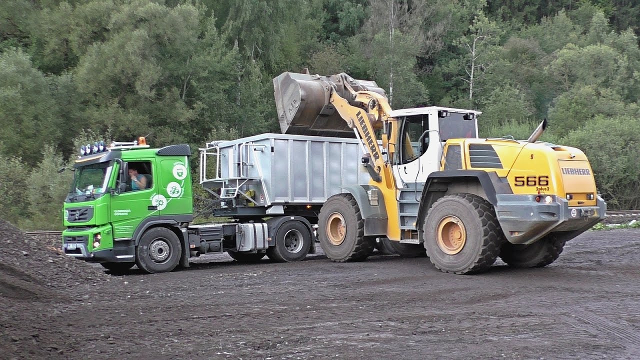 Liebherr 566 load Volvo FMX and Scania R with trailers
