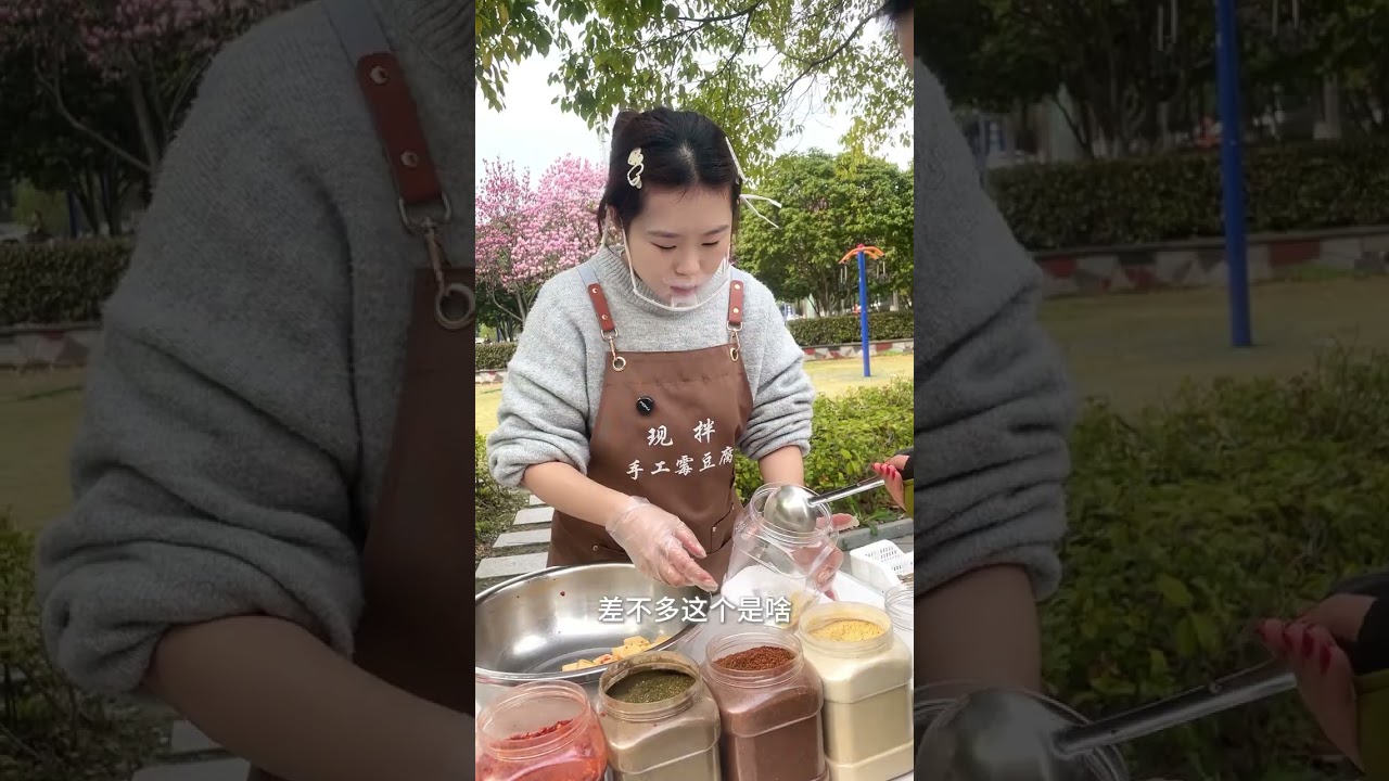 The beautiful lady insisted on experiencing it saying that scraping tofu was particula