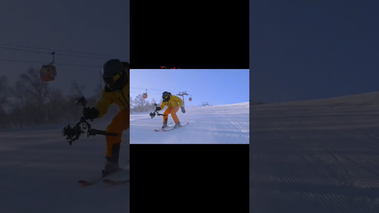 A photographer who is good at skiing 