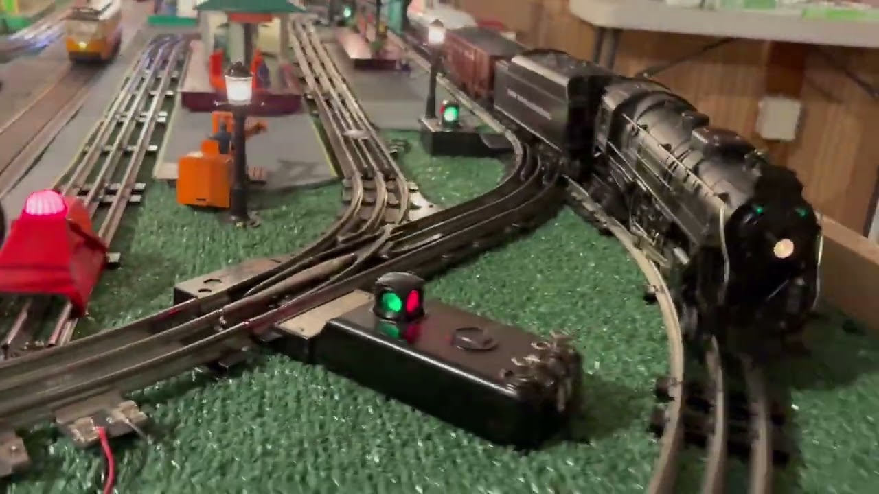 K-Line O Scale freight cars and smoking caboose.