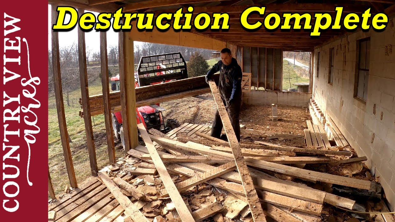 Finishing Demolition on the Bank Barn.  Removing the rest of floor and the concrete blocks.