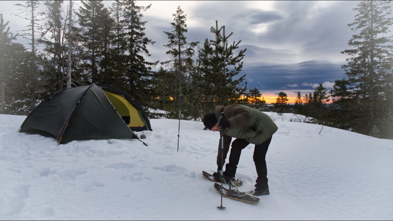 From Dusk Till Dawn - tent camping on a snowy hill.
