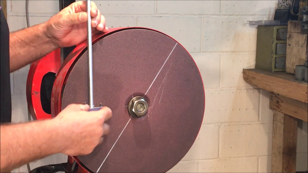 Sheep Shearing Equipment Grinding a shearers cutter on the grinding disc.
