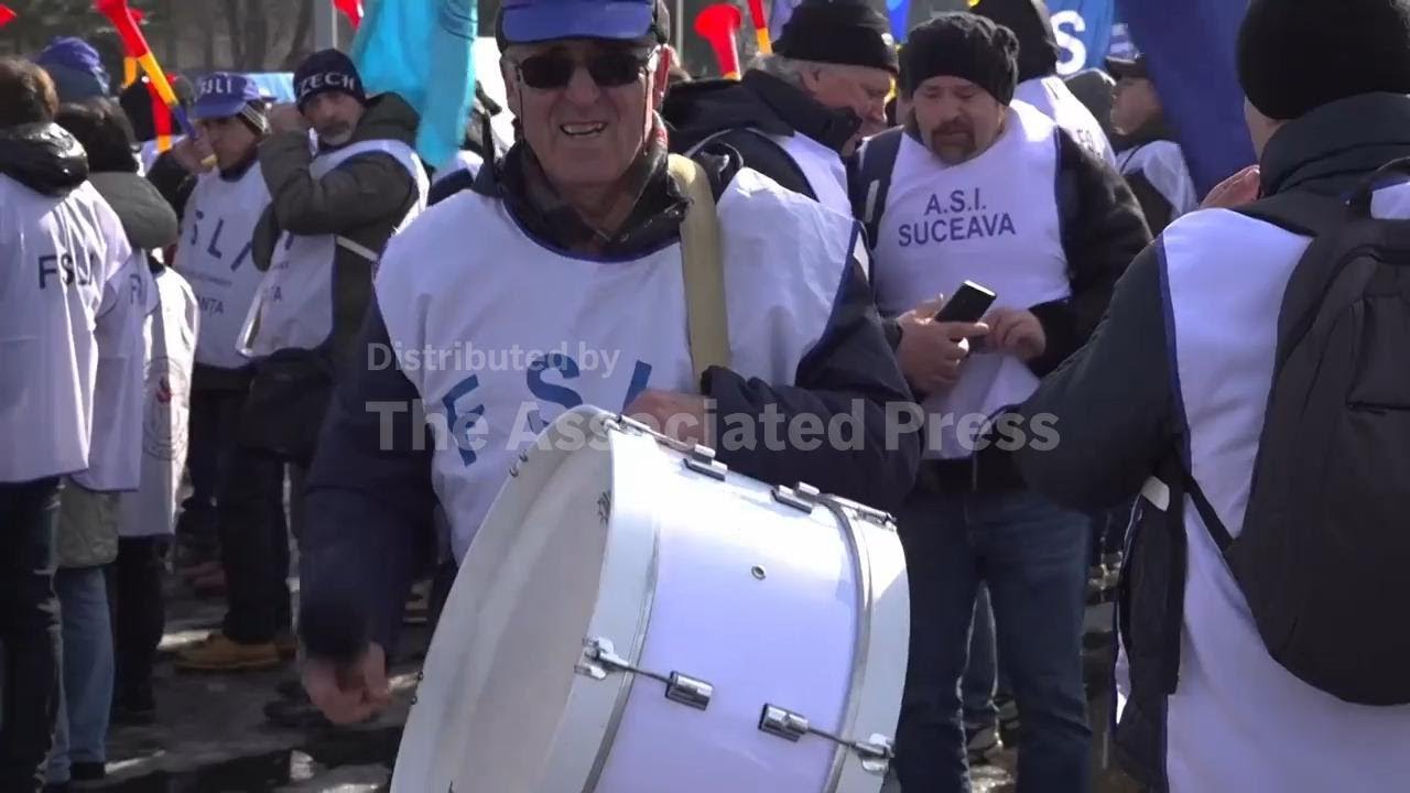 Teachers rally outside government building in Bucharest to protest austerity measures