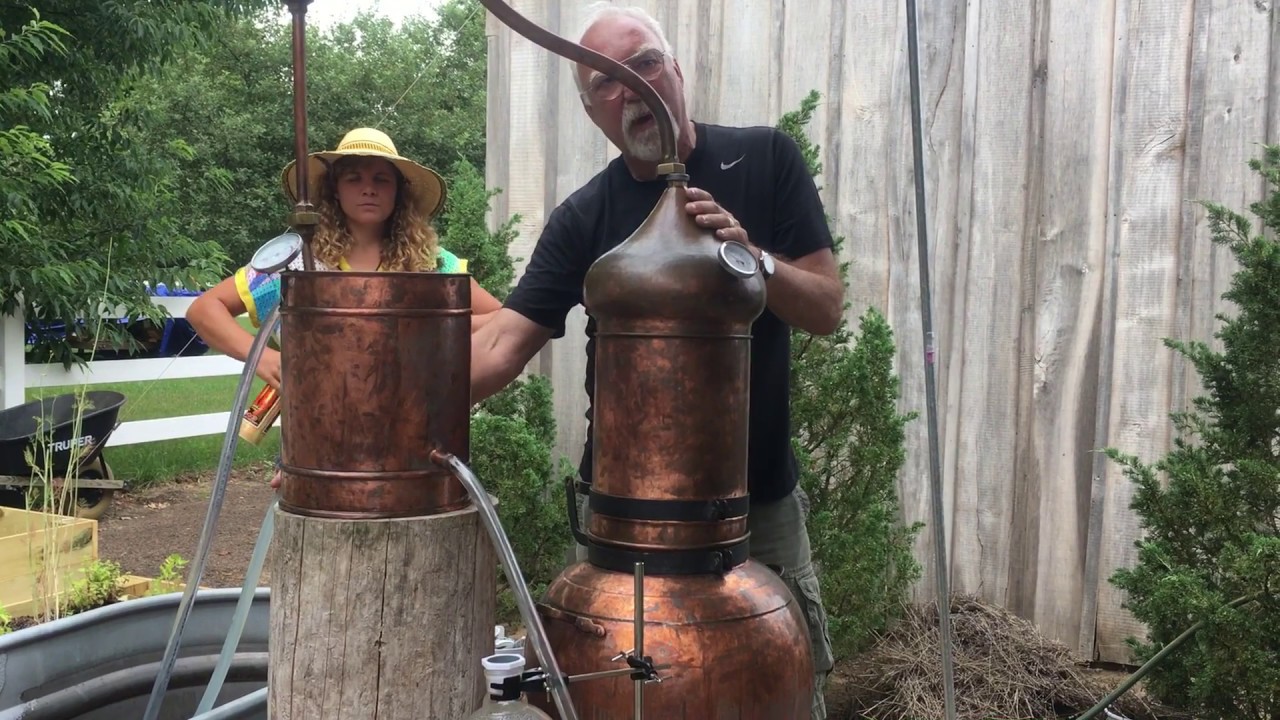 Lavender farmer demonstrates distilling process