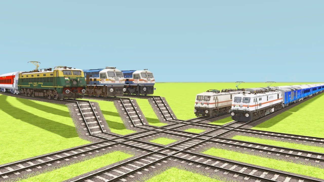 3 TRAINS OVER CROSSING ON FLYING AND GO-DOWN RAILROAD TRACKS
