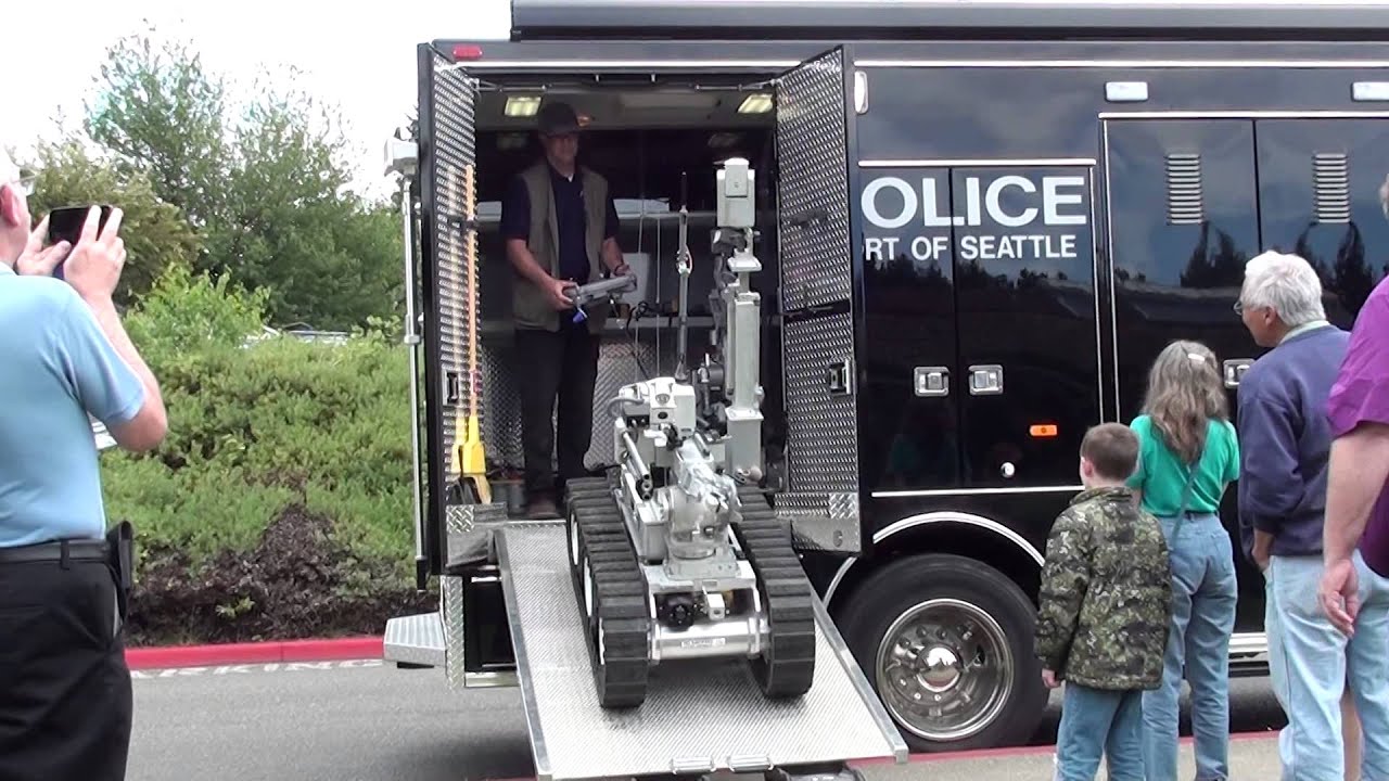 Port of Seattle Police loading robot on truck.