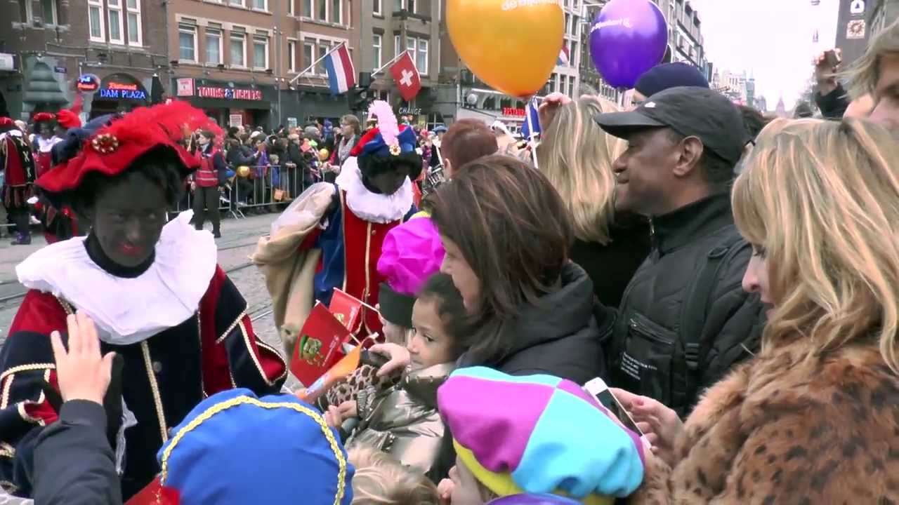 Santa and his army of black Pete helpers arrives in Amsterdam.