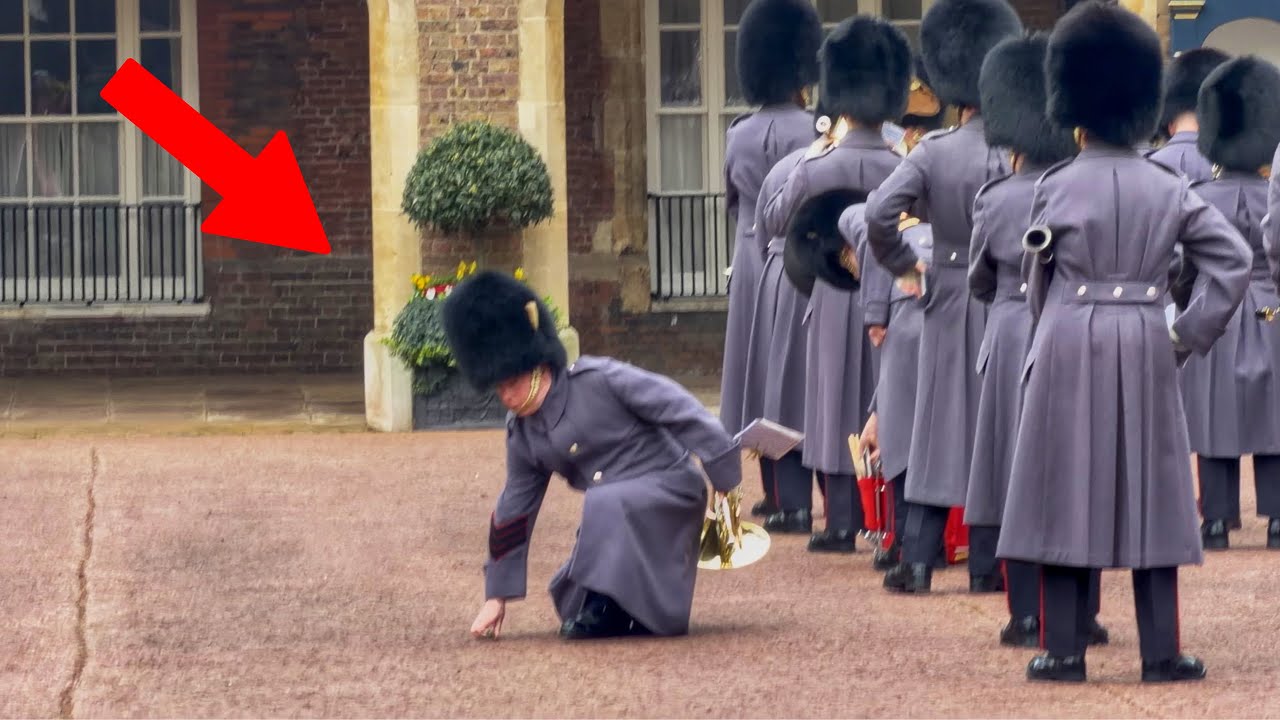 Professional Reflexes on Display at Guard Change: Grenadier Band Member Retrieves Fallen Item