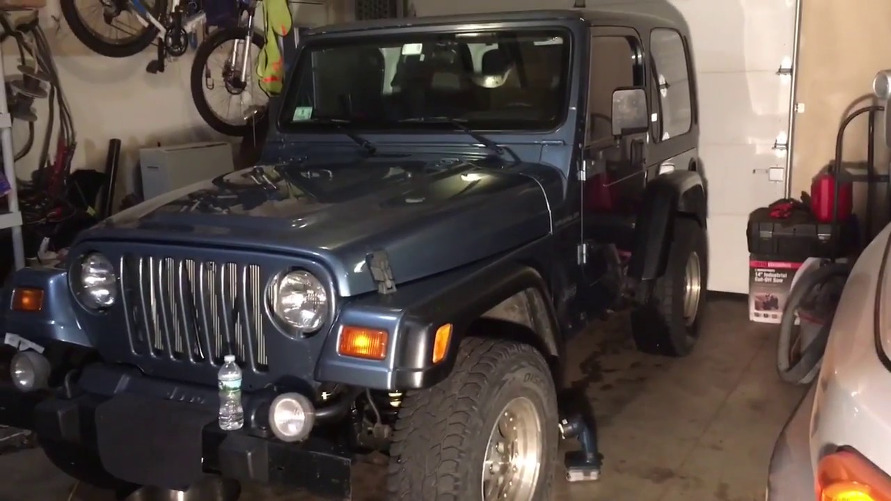 Drilling Drain Holes in a Jeep Wrangler Frame to Prevent Rust and Rot