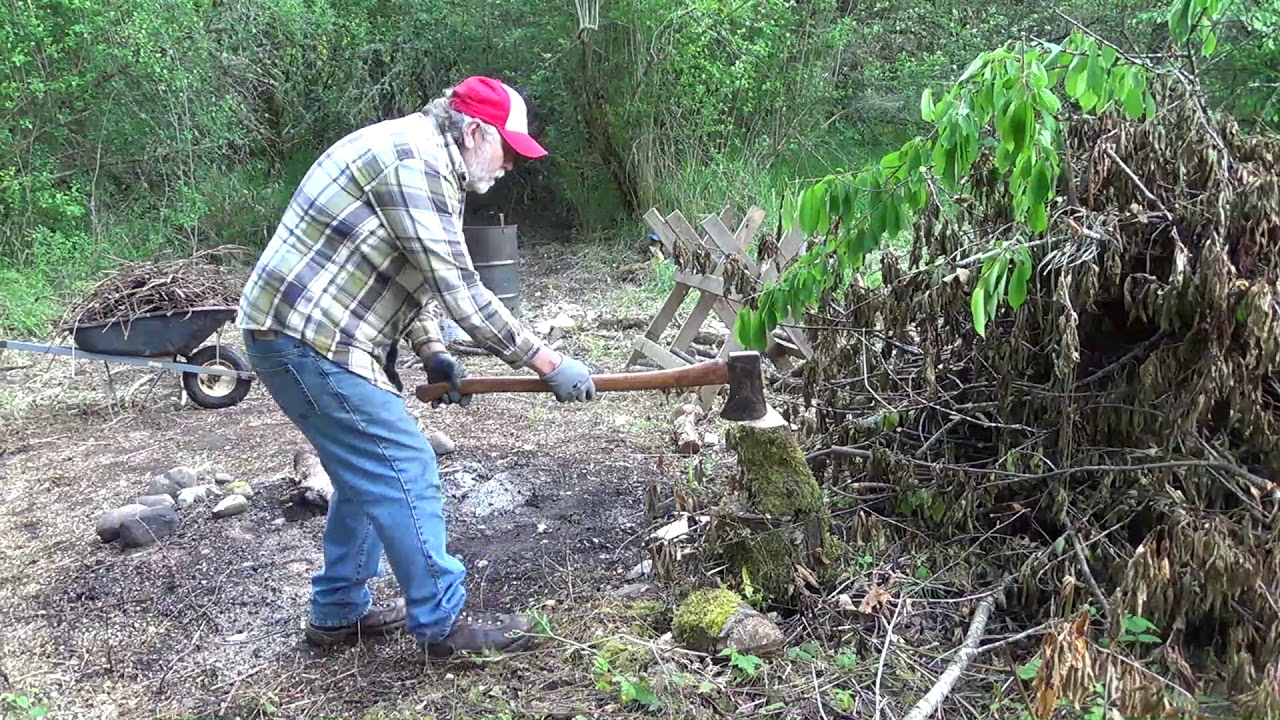 vintage chainsaws, axe, pickaroon, garden tractor processing firewood