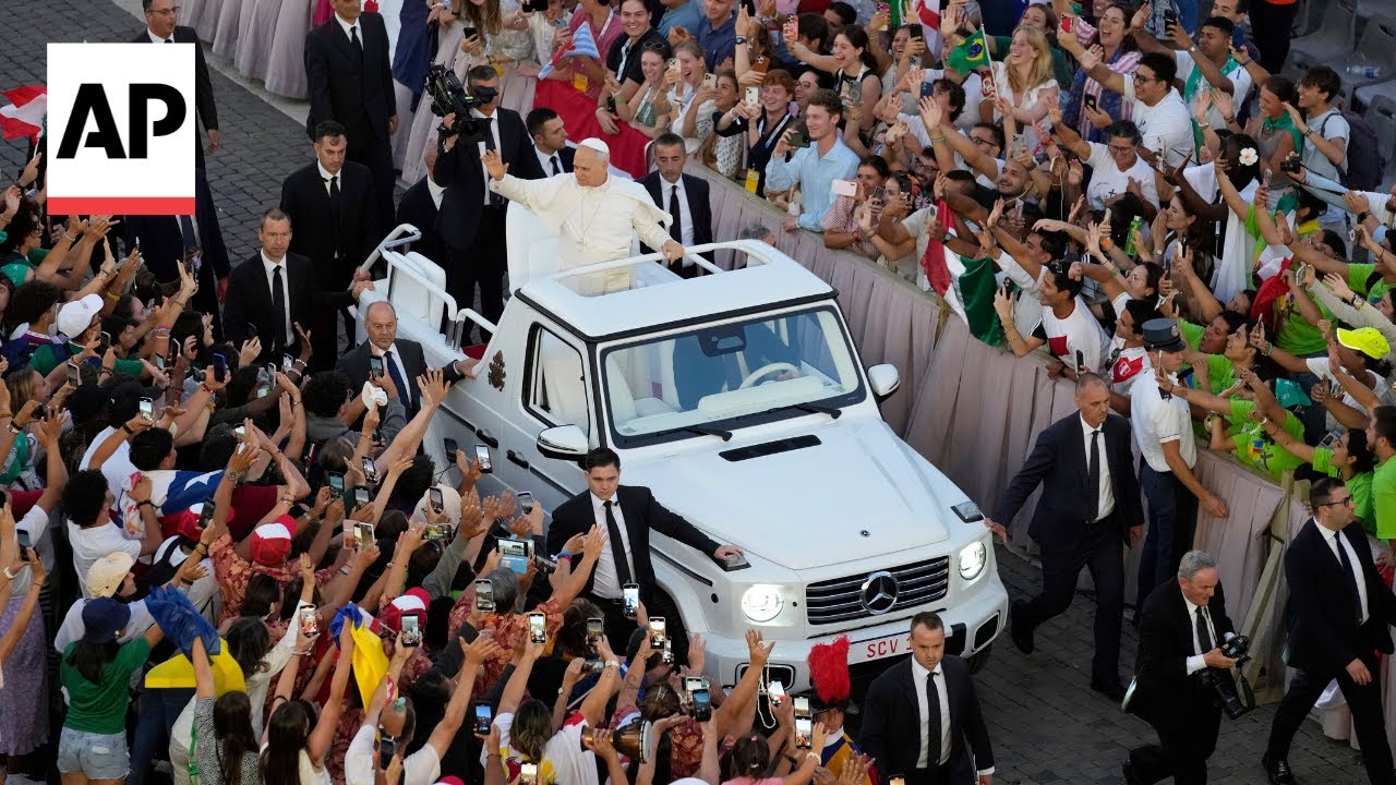 Pope Leo XIV surprises Catholic youth festival with popemobile salute