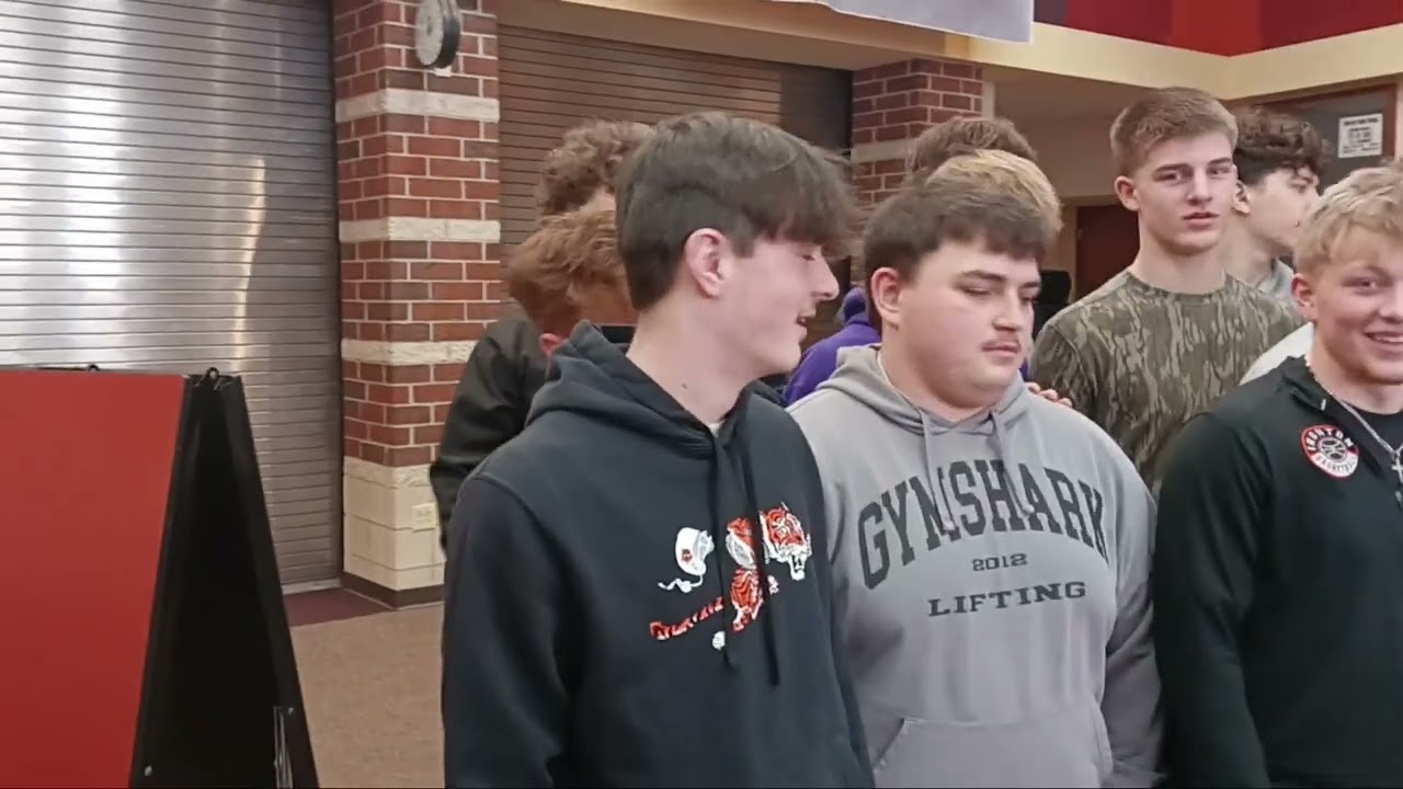 Surrounded by the Ironton High football team, Zayne Williams signed to play football at Tiffin Univ.