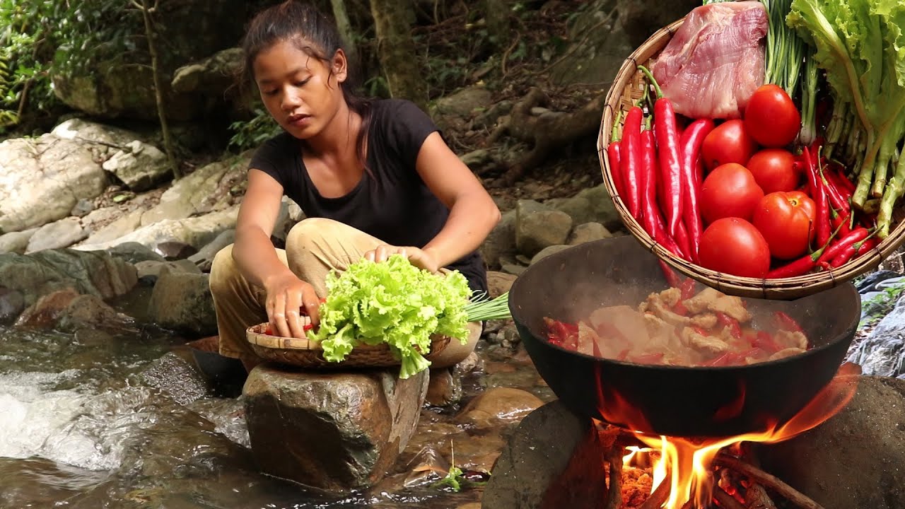 Yummy pork spicy cooking with salad for food of survival in the forest
