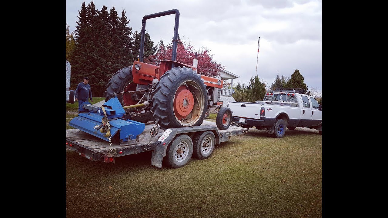 F350 Hauling Farm Tractor
