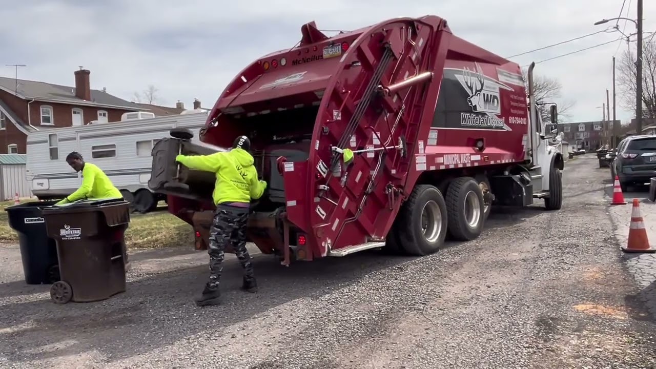 Whitetail Disposal freightliner Mcneilus red body with black and white logo rear loader ~211