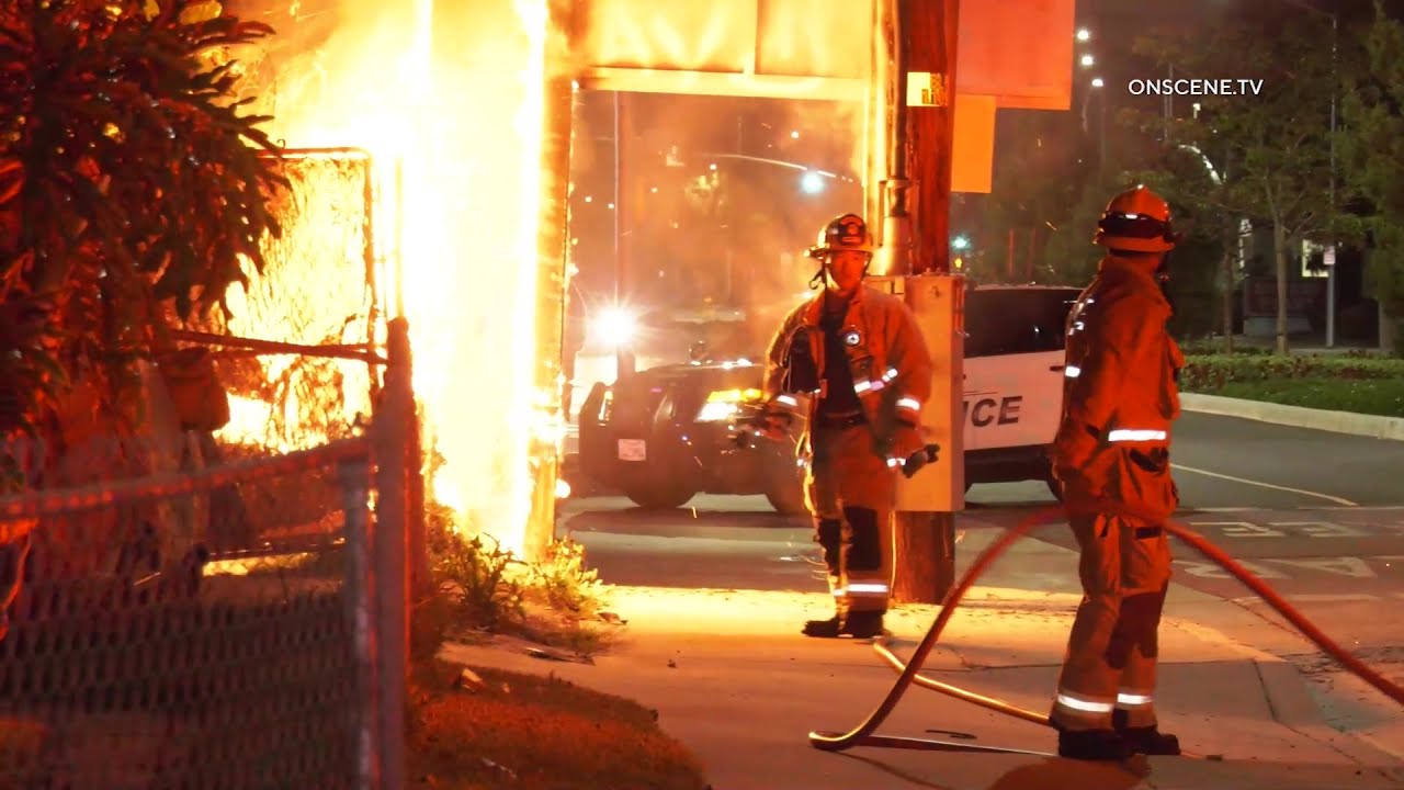 Backyard Fire Scorches Freeway Sign | Downey