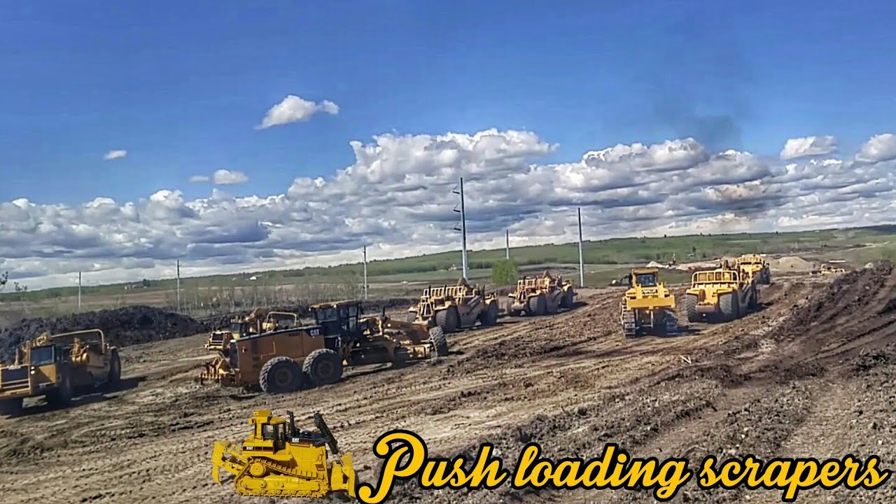 Push loading a fleet of scrapers