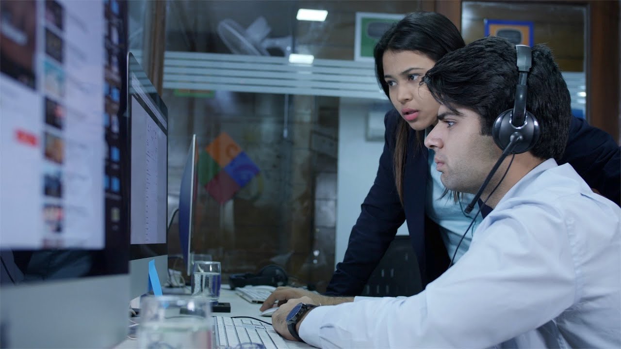 Young Indian boy and girl (boss) discussing office work while ... | Indian Stock Footage | Knot9