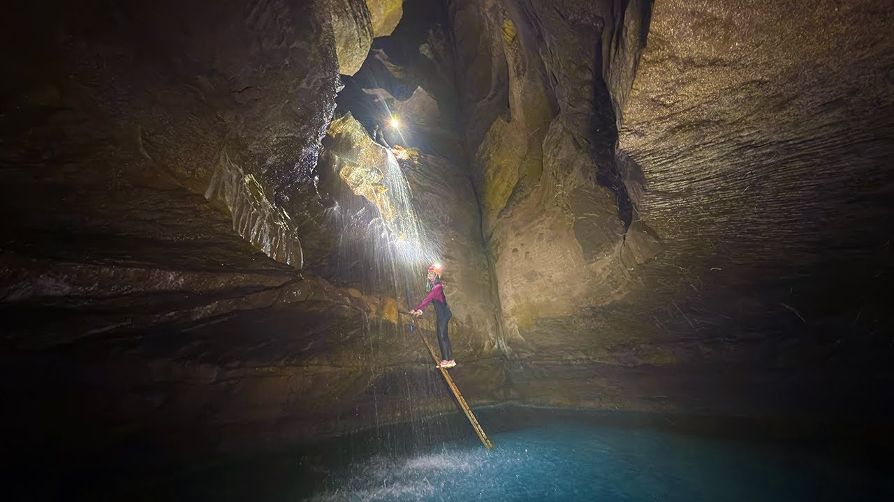 Rusty Ladder Leads to Miles of River Cave