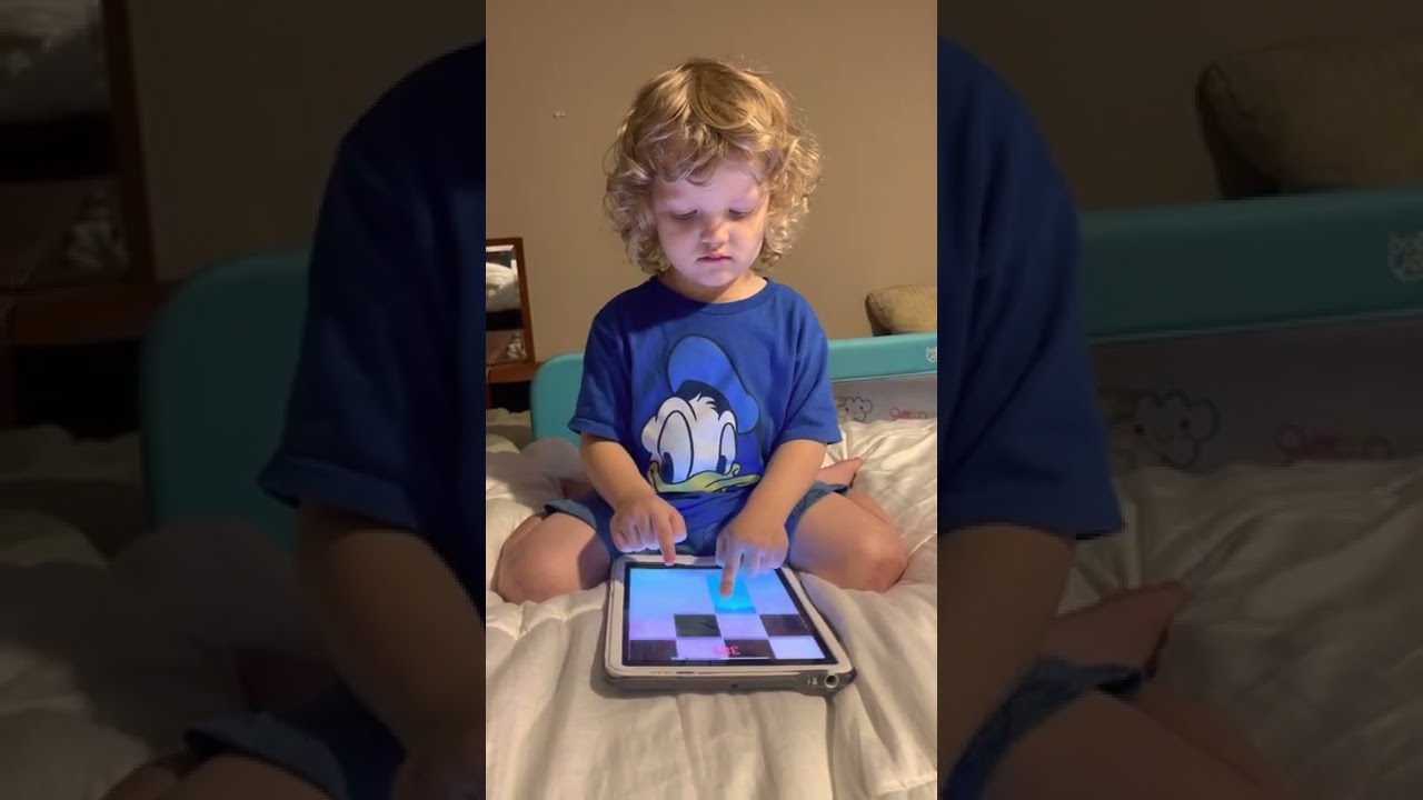 4 Year Old Jakey hamming it up on piano tiles!