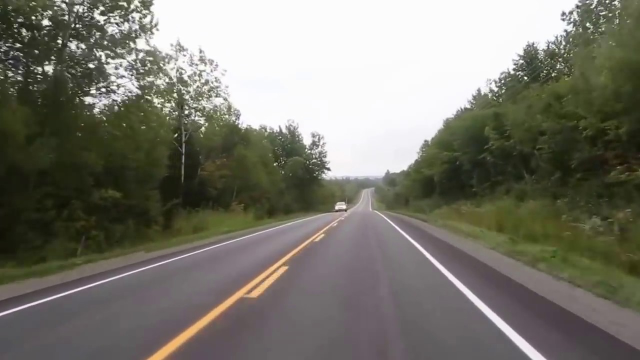 Car driving down road with electronic music background