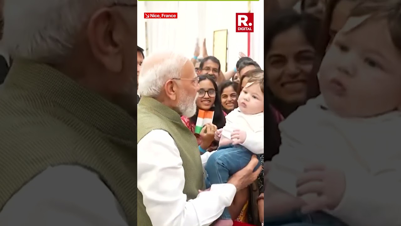 PM Modi Shares Joyful Moment with Child During Reception in France