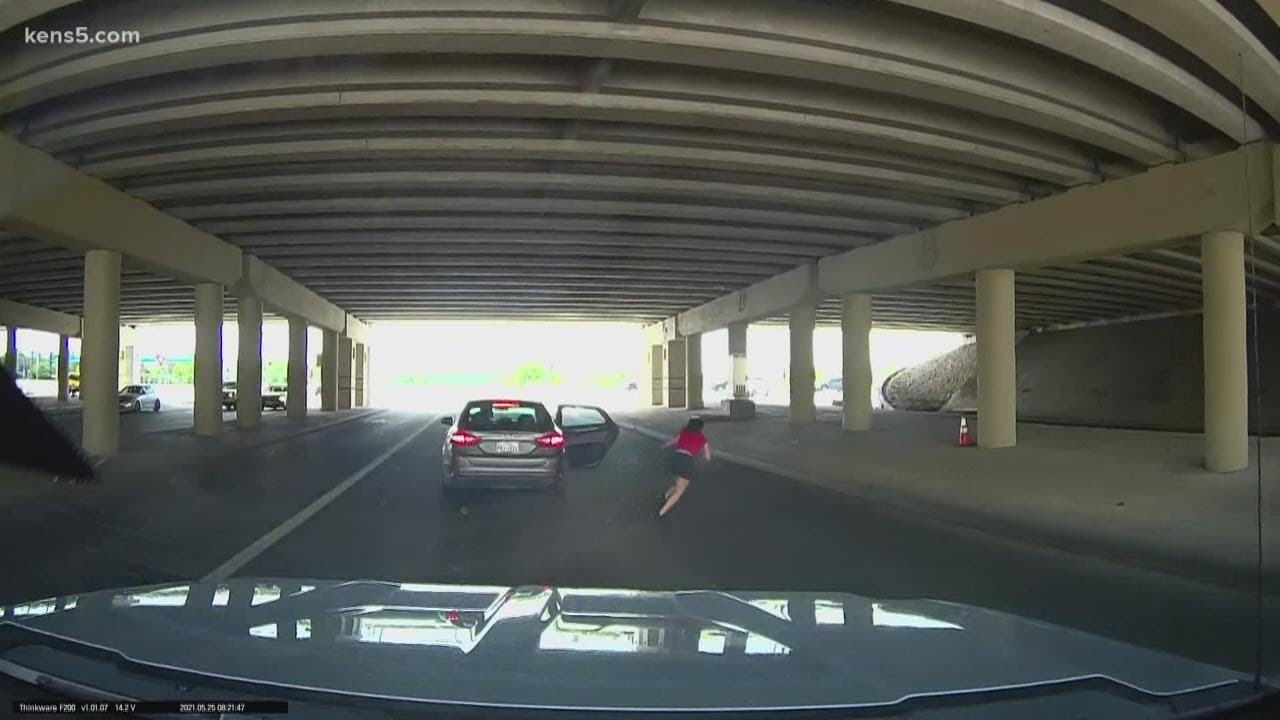 San Antonio man's dash cam captures woman attempting to escape moving car during attack