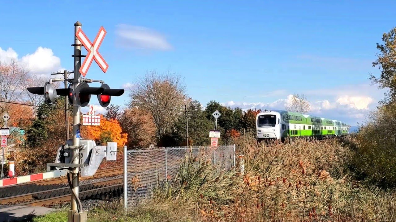 GO Train and VIA Rail at Beechgrove Drive railway crossing (Toronto)
